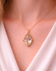 The Aura Orb Pendant (14k Yellow Gold, Quartz, and Pink Sapphire)